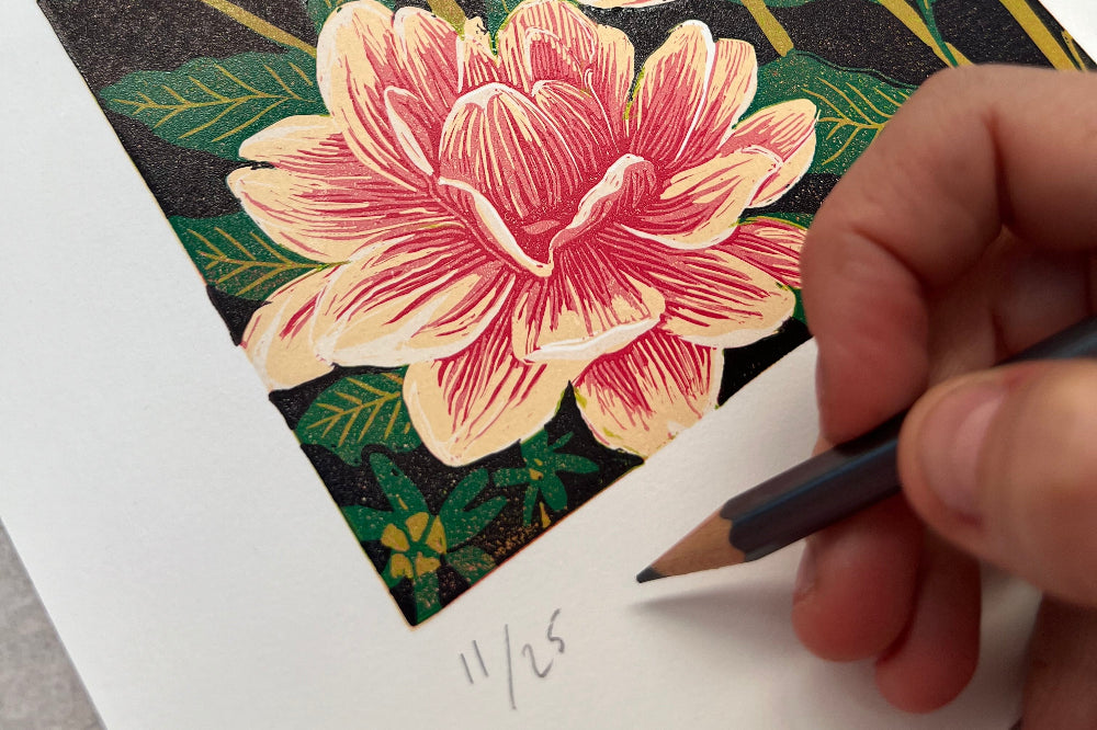 Hand signing a limited edition print