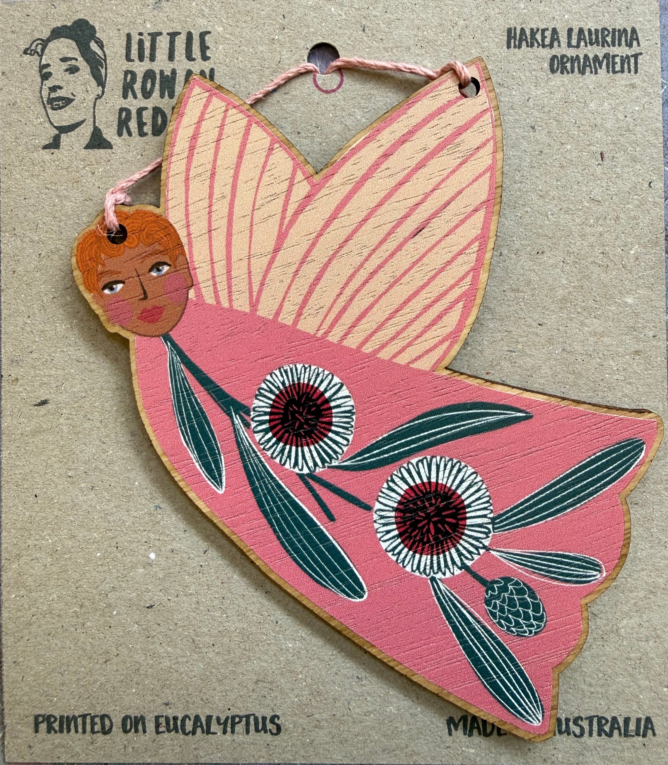 A pink fairy ornament featuring a Hakea Laurina design