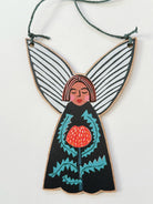 Wooden Christmas fairy ornament strung with hemp cord featuring a banksia design. Made in Australia, available for wholesale. 