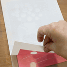 Process of showing the print being pulled off the print block. 