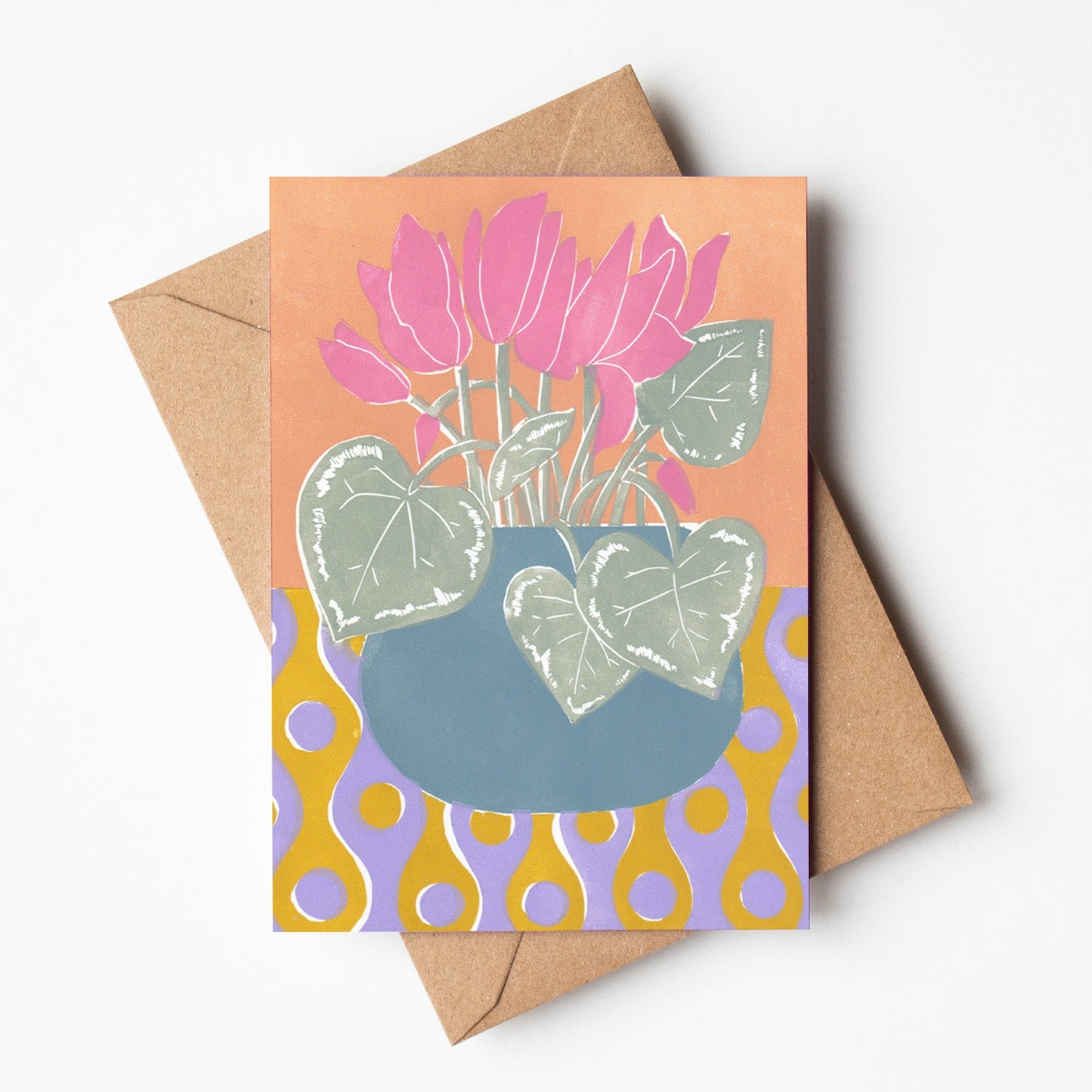 Greeting card featuring a bold linoprint of a pink cyclamen flowers, colourful Australian botanical stationery