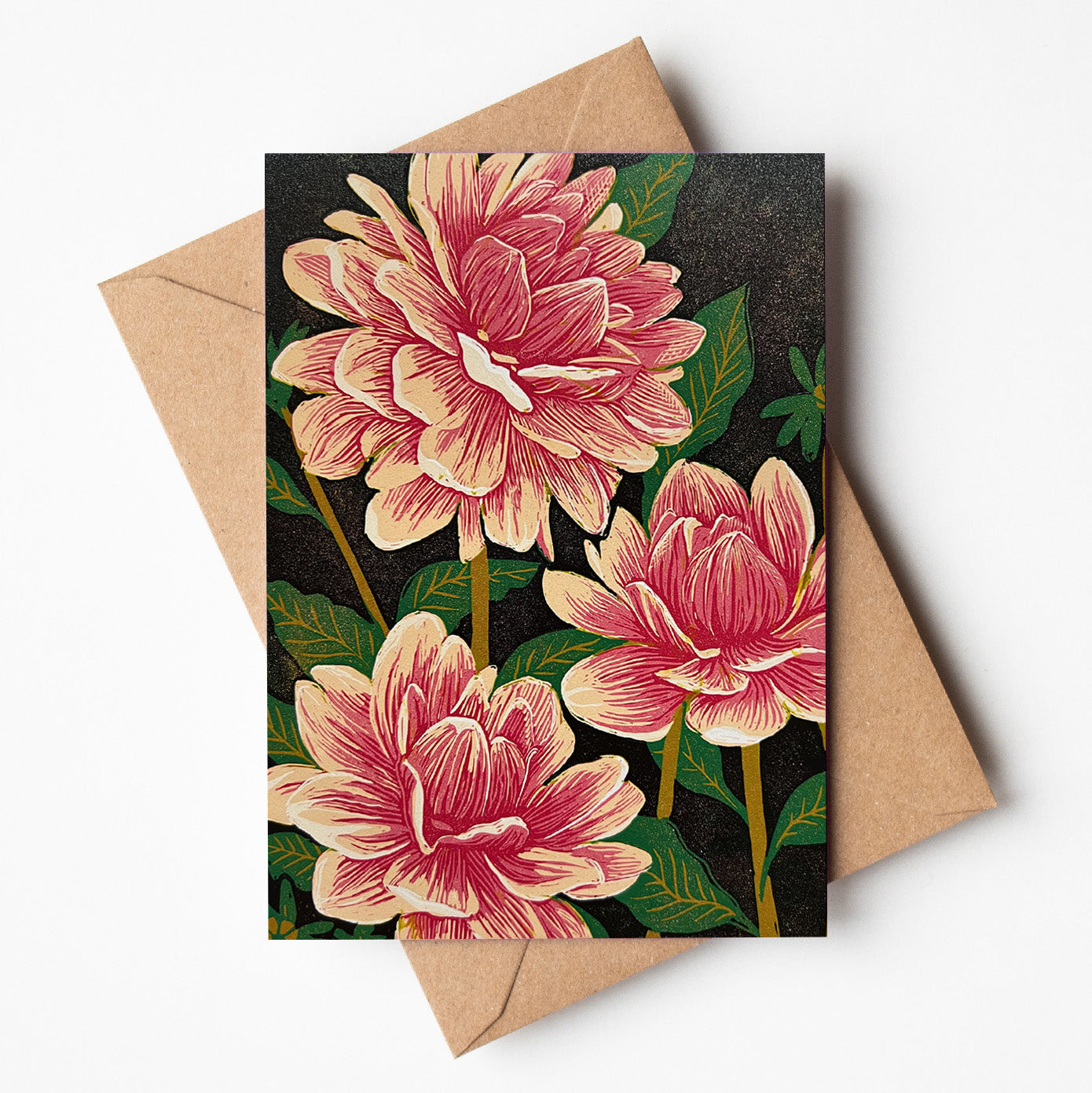 Greeting card featuring a bold linoprint of three pink dahlia flowers, colourful Australian botanical stationery