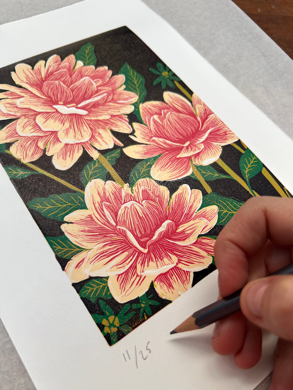 Hand signing a limited edition print
