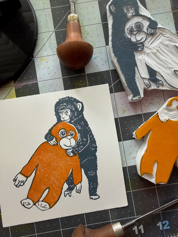 A5 linocut art print baby macaque and plush orangutan detailed view hand carved