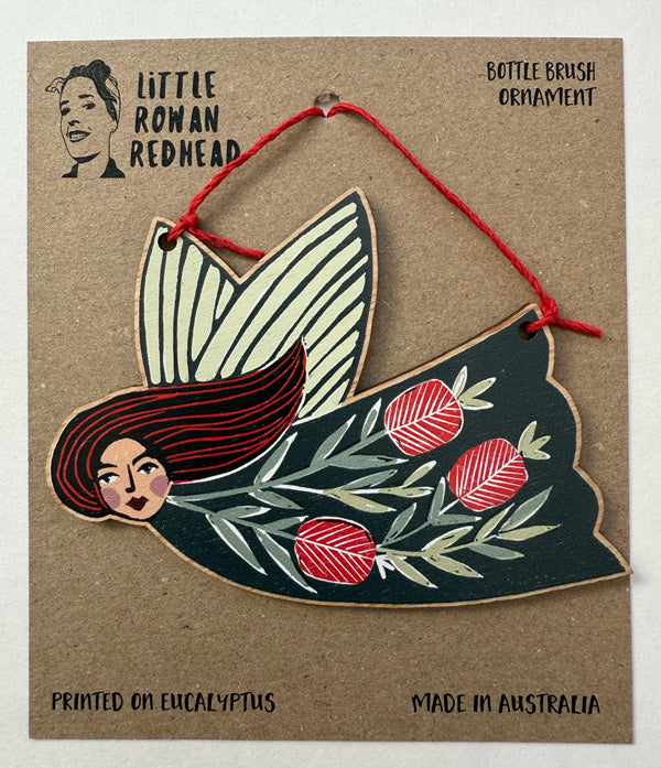 Wooden Christmas fairy ornament featuring native bottle brush flowers strung with hemp cord, made in Australia and available for wholesale. 