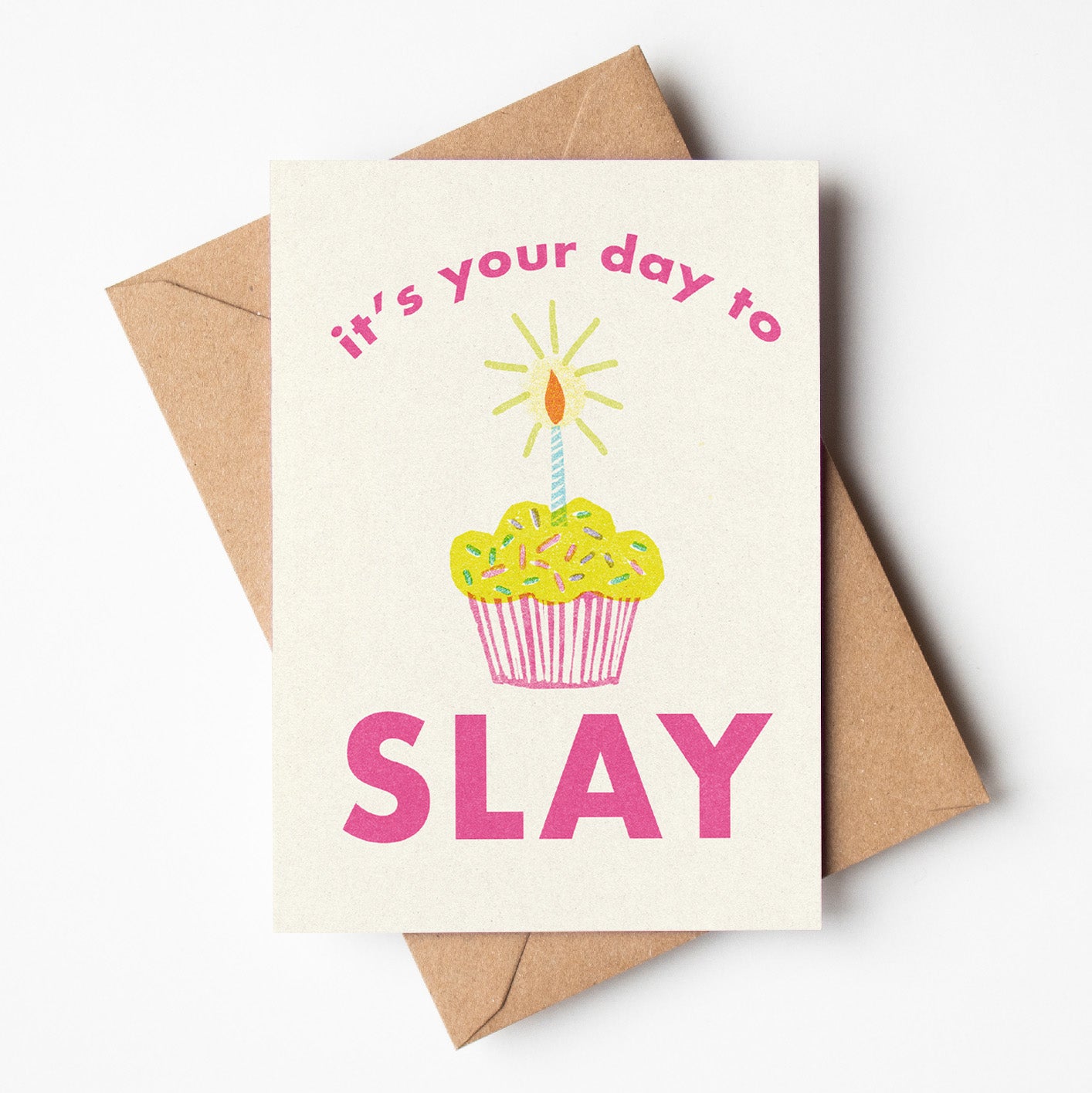 Birthday card featuring the phrase 'it's your day to slay' with a cupcake and a candle, made in Australia and available for wholesale. 