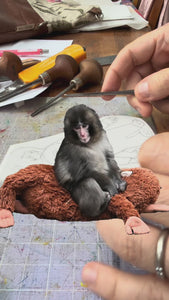 Hand carved stamp linocut printing process baby macaque