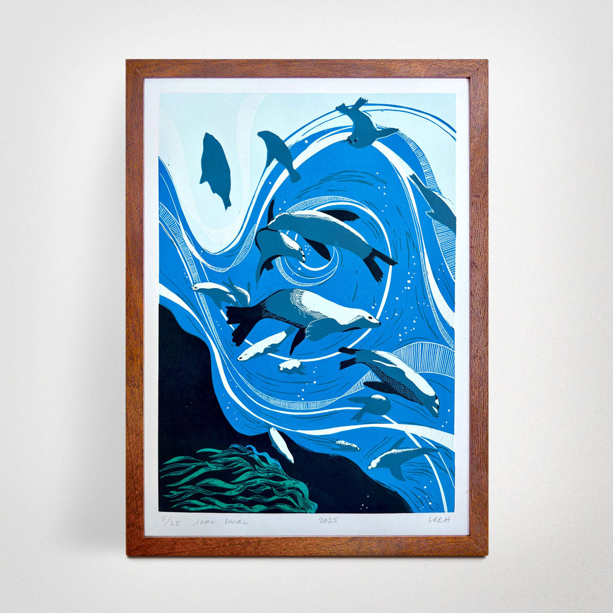 Linoprint art of seals swirling in the sea, handmade in Australia