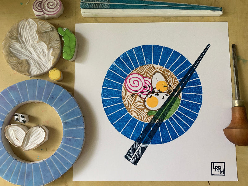 Process shot showing the finished ramen linoprint and the stamps used to make the print, made in Australia
