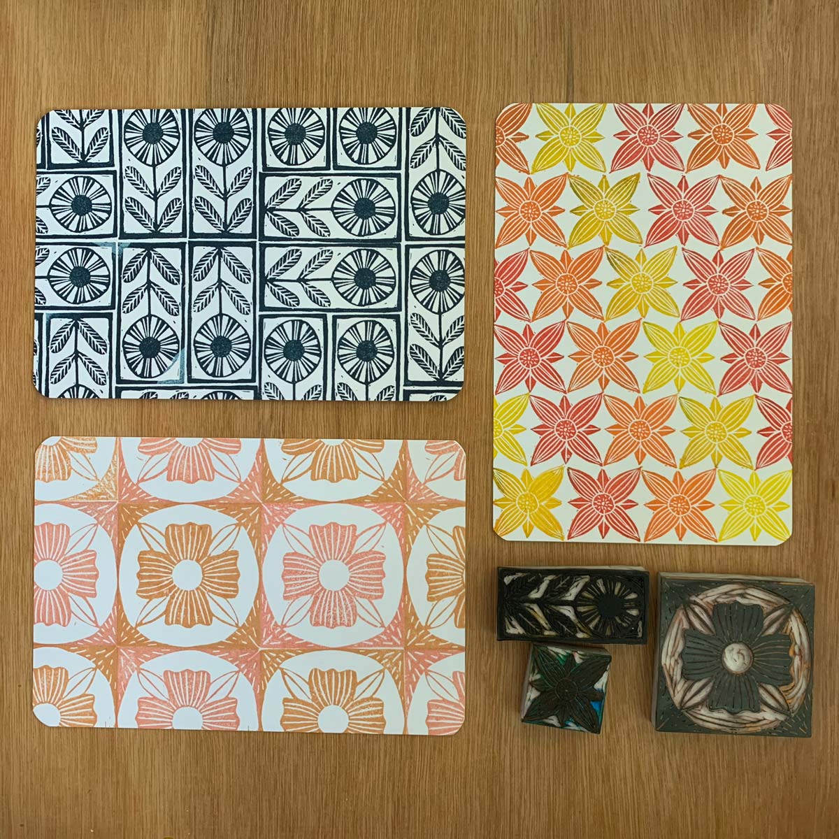 A set of three hand carved stamps and examples of the patterns they make.
